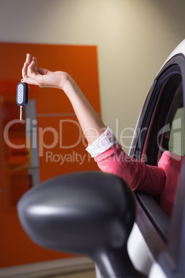 Womans hand holding car key