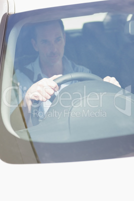 Focused man sitting at the wheel