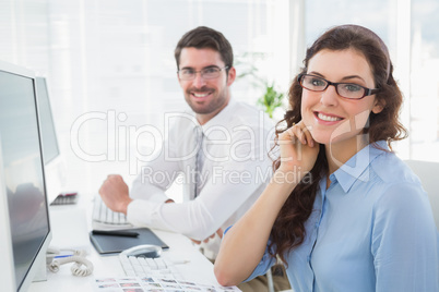 Portrait of smiling business coworkers sitting