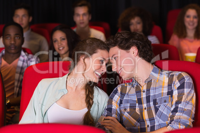 Young couple watching a film