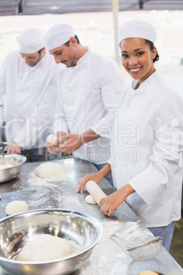 Team of bakers working at counter