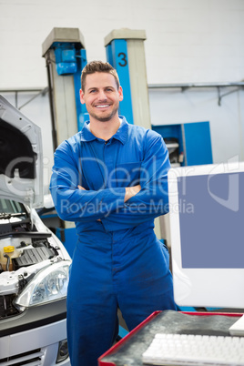 Mechanic smiling at the camera