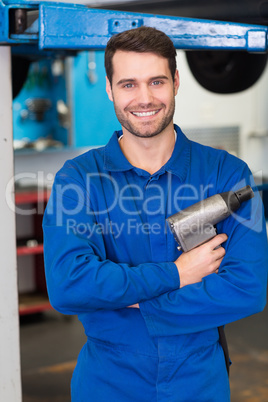 Mechanic holding a drill tool