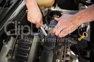 Mechanic working under the hood