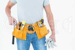 Technician holding gloves and hammer