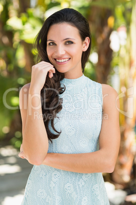 Stylish brunette smiling at camera