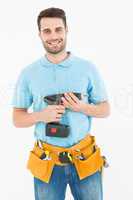 Happy repairman holding hand drill