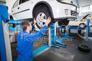 Mechanic adjusting the tire wheel