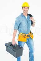 Happy electrician with tool box and wire