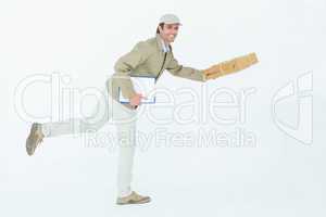 Happy delivery man running while holding parcel