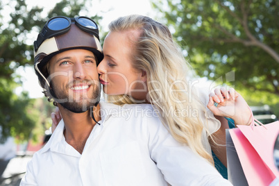 Attractive couple riding a scooter