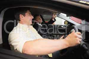 Man pointing a car interior