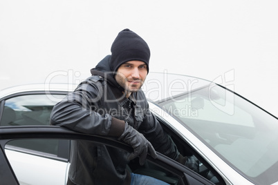 Car thief looking at camera