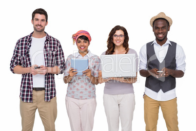 Smiling coworkers with technology posing