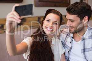 Cute couple on a date taking a selfie