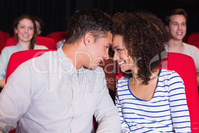 Young couple watching a film