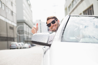 Happy businessman in the drivers seat