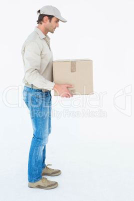 Delivery man carrying cardboard box