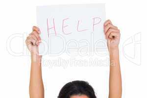 Brunette holding up help sign