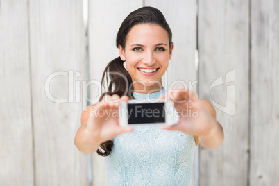 Stylish brunette taking a selfie