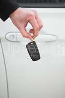 Close up of businessman holding car key