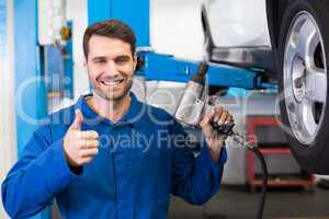 Mechanic adjusting the tire wheel