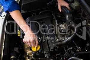 Mechanic working under the hood