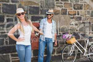 Attractive couple standing with bikes