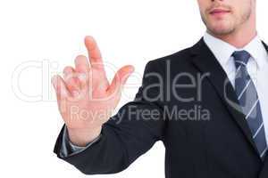 Focused businessman pointing with his finger