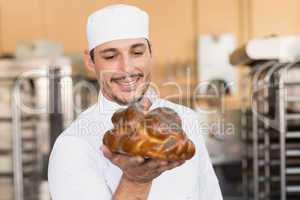 Baker checking freshly baked bread