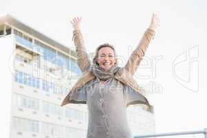 Happy blonde standing and cheering