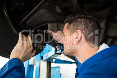 Mechanic adjusting the tire wheel