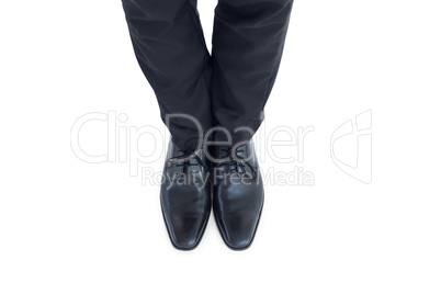 Businessmans feet in black brogues