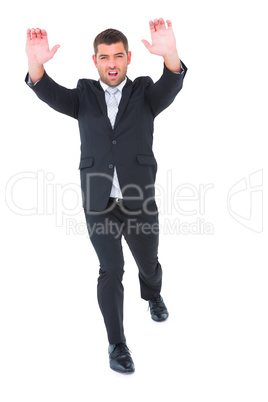 Businessman with his hands up