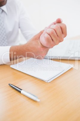 Businessman holding his hand