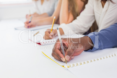 Students taking notes in class