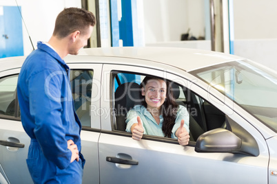 Customer showing thumbs up to camera