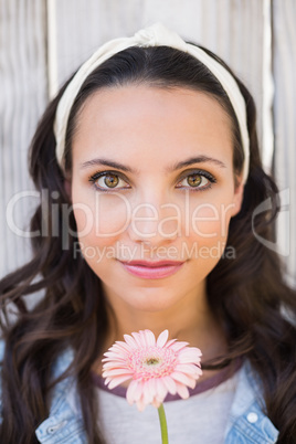 Pretty hipster holding a flower