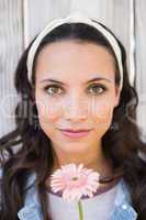 Pretty hipster holding a flower