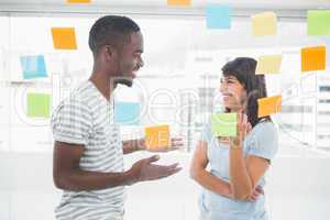 Happy coworkers standing and interacting together