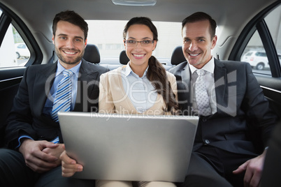 Business team working in the back seat