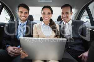 Business team working in the back seat