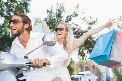 Cute couple riding a scooter