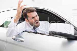 Businessman experiencing road rage