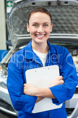 Mechanic smiling at the camera