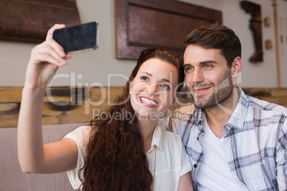 Cute couple on a date taking a selfie