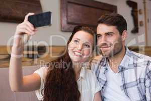 Cute couple on a date taking a selfie