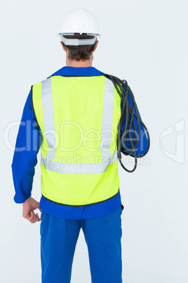 Rear view of electrician with wire