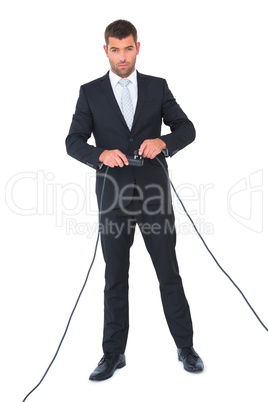 Businessman connecting a plug