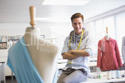 Fashion student sitting with arms crossed